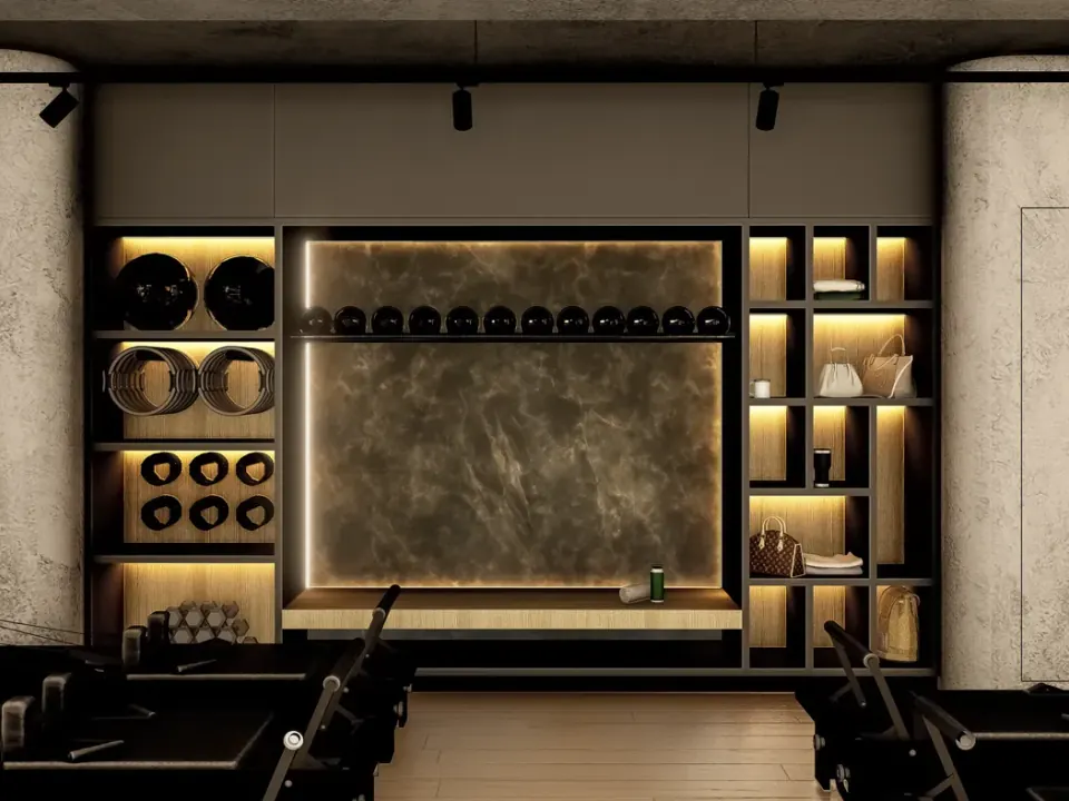 Mueble oscuro con nichos de luz cálida para accesorios, bolsas y toallas, y un panel veteado retroiluminado al centro