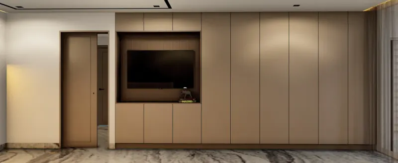 Mueble empotrado de piso a techo en tono beige con nicho para televisión y una puerta a un costado, sobre piso veteado